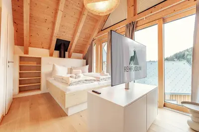 Ein Bett oder Betten in einem Zimmer der Unterkunft Rehfugium Lachtal by ALPS RESORTS