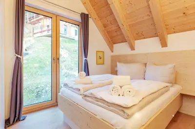 Ein Bett oder Betten in einem Zimmer der Unterkunft Rehfugium Lachtal by ALPS RESORTS
