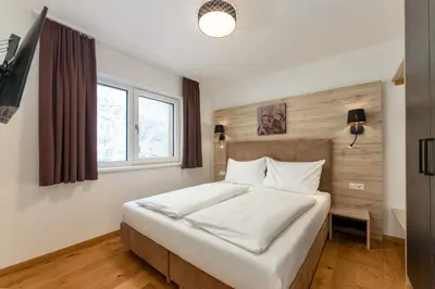 Ein Bett oder Betten in einem Zimmer der Unterkunft Franz Johann Appartement SKI-IN SKI-OUT by Schladming-Appartements