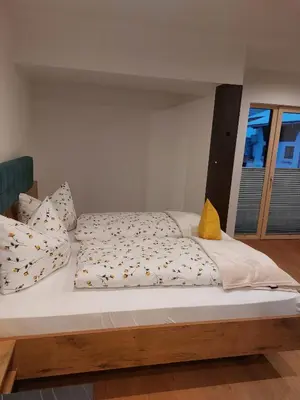 Ein Bett oder Betten in einem Zimmer der Unterkunft Apartments-Salzkammergut Gosausee