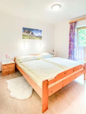 Ein Bett oder Betten in einem Zimmer der Unterkunft Ferienwohnung Haus Waldheim