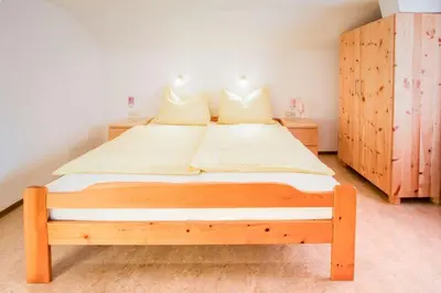 Ein Bett oder Betten in einem Zimmer der Unterkunft Ferienwohnung Haus Waldheim