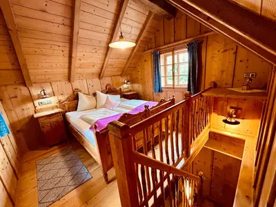Ein Bett oder Betten in einem Zimmer der Unterkunft Urige Kuschelhütten Oberprenner