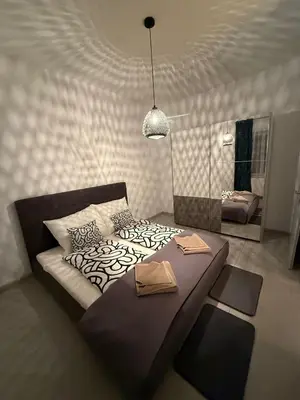 Ein Bett oder Betten in einem Zimmer der Unterkunft Ferienwohnung Bischofshofen
