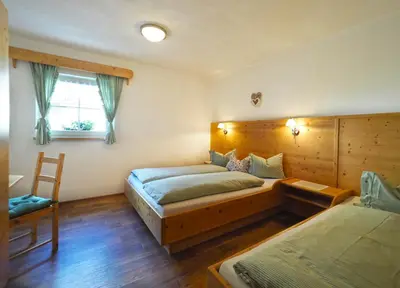 Ein Bett oder Betten in einem Zimmer der Unterkunft Lürzergut