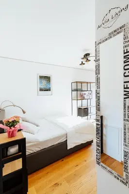 Ein Bett oder Betten in einem Zimmer der Unterkunft ArVia Living - Ferienwohnung in Altmünster, zentrale Lage, 7 Min Gehweg zum Traunsee, Küche, gratis Parkplatz & WLAN
