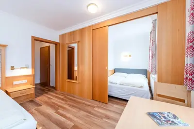 Ein Bett oder Betten in einem Zimmer der Unterkunft Reisslerhof Hotel & Apartments - by myNests