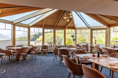 Ein Restaurant oder anderes Speiselokal in der Unterkunft Hotel Das Hochkönig