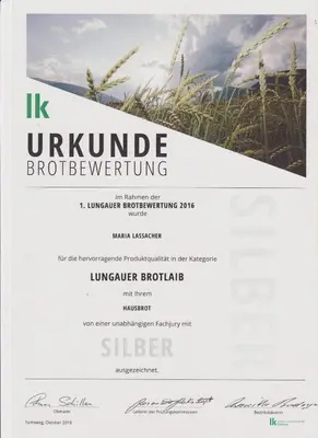 Ein Zertifikat, Auszeichnung, Logo oder anderes Dokument, das in der Unterkunft Lassacher Biobauernhof ausgestellt ist