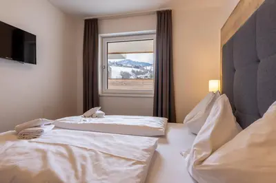 Ein Bett oder Betten in einem Zimmer der Unterkunft Appartementhaus Falke und Adler