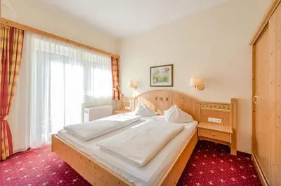 Ein Bett oder Betten in einem Zimmer der Unterkunft Gästehaus Anneliese