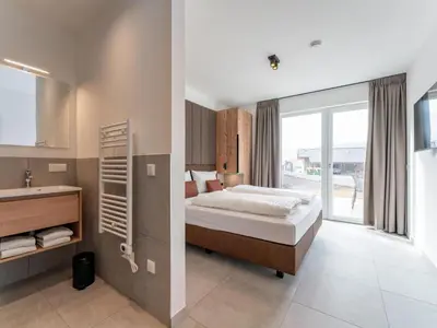 Ein Bett oder Betten in einem Zimmer der Unterkunft Grebenzen Lodges 49B