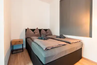 Ein Bett oder Betten in einem Zimmer der Unterkunft Im Herzen von Bad Ischl #2