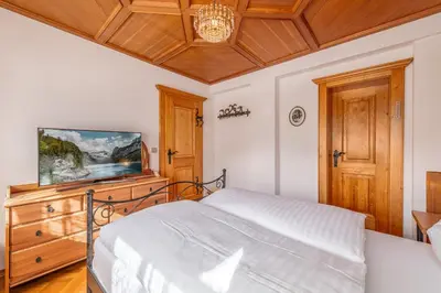 Ein Bett oder Betten in einem Zimmer der Unterkunft Alpenvilla Janerweg - by myNests