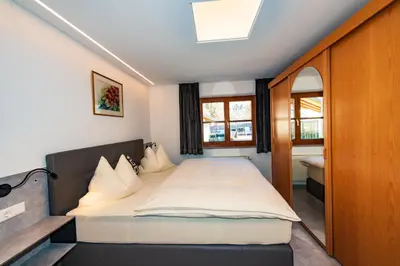 Ein Bett oder Betten in einem Zimmer der Unterkunft Ferienhaus mit 5 separaten Schlafmöglichkeiten