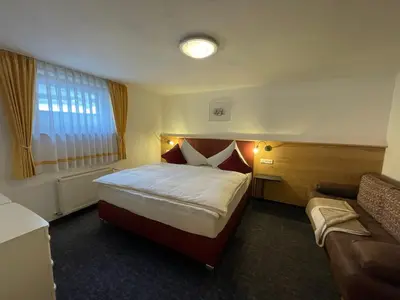 Ein Bett oder Betten in einem Zimmer der Unterkunft Ferienhaus mit 5 separaten Schlafmöglichkeiten