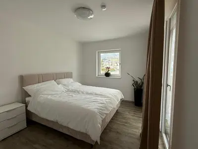 Ein Bett oder Betten in einem Zimmer der Unterkunft Ferienwohnung am Schlosspark