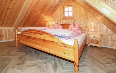 Ein Bett oder Betten in einem Zimmer der Unterkunft Ferienhaus Mit Sauna