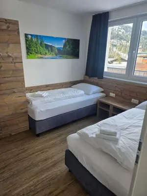 Ein Bett oder Betten in einem Zimmer der Unterkunft Haus Tauernblick