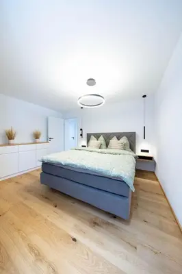 Ein Bett oder Betten in einem Zimmer der Unterkunft Blütenzauber am Mondsee