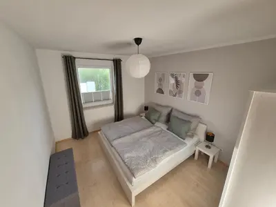 Ein Bett oder Betten in einem Zimmer der Unterkunft Apartment West