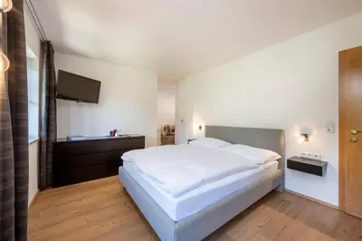 Ein Bett oder Betten in einem Zimmer der Unterkunft Panorama Mountain & Castle View Apartment D'Fidlerin Salzburg