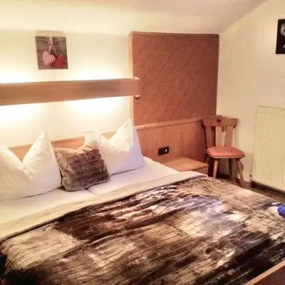 Ein Bett oder Betten in einem Zimmer der Unterkunft Gästehaus Schwed