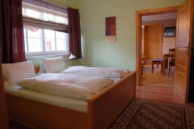 Ein Bett oder Betten in einem Zimmer der Unterkunft Ferienwohnungen Primoschitz