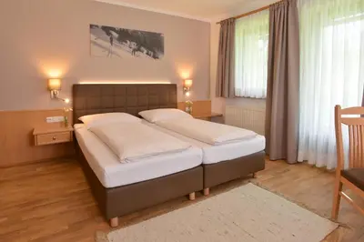 Ein Bett oder Betten in einem Zimmer der Unterkunft Landhotel Gressenbauer