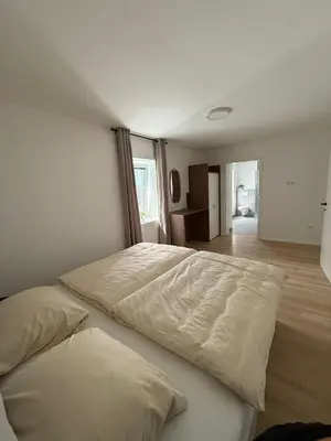 Ein Bett oder Betten in einem Zimmer der Unterkunft ALS Zimmer & Suiten