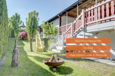 Ein Garten an der Unterkunft Bungalow - Kinderspielplatz - Garten mit Feuerstelle