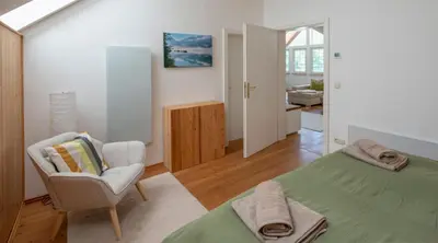Ein Bett oder Betten in einem Zimmer der Unterkunft SeeAtelier Grundlsee - Your Austrian Home