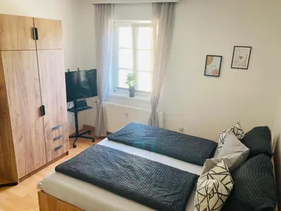 Ein Bett oder Betten in einem Zimmer der Unterkunft Apartment beim Schloss Ort mit Balkon und Parkplatz