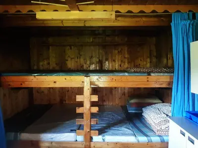 Ein Bett oder Betten in einem Zimmer der Unterkunft Gscheidegger Hütte