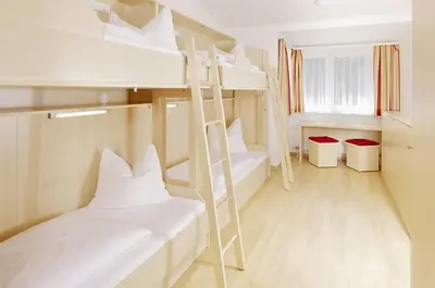 Ein Bett oder Betten in einem Zimmer der Unterkunft Jugendgästehaus Mondsee