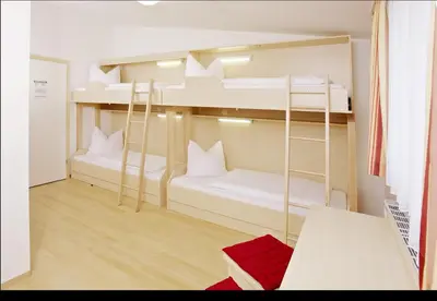 Ein Bett oder Betten in einem Zimmer der Unterkunft Jugendgästehaus Mondsee