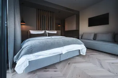 Ein Bett oder Betten in einem Zimmer der Unterkunft Alpine Boutique Hotel wollée
