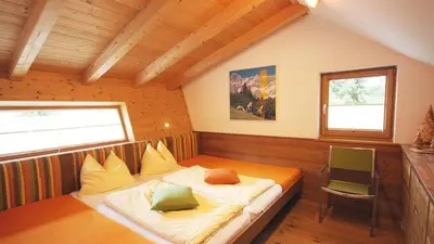 Ein Bett oder Betten in einem Zimmer der Unterkunft Alpin-Chalet Flachau