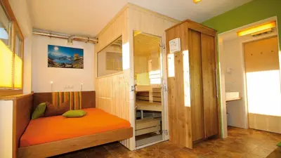Ein Bett oder Betten in einem Zimmer der Unterkunft Alpin-Chalet Flachau