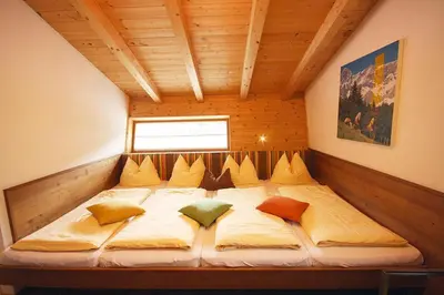 Ein Bett oder Betten in einem Zimmer der Unterkunft Alpin-Chalet Flachau