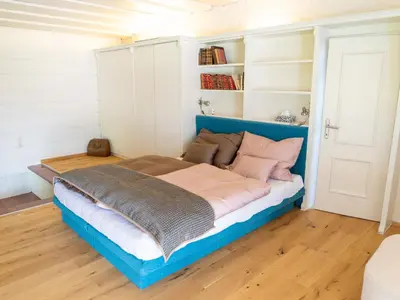 Ein Bett oder Betten in einem Zimmer der Unterkunft Apartment Penthouse Deluxe Galerie 2 stöckig by Interhome