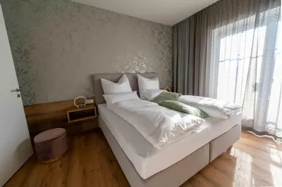 Ein Bett oder Betten in einem Zimmer der Unterkunft SINGULAR - Mountainview Apartments