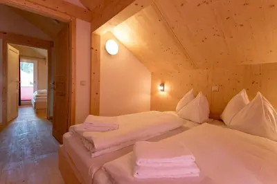 Ein Bett oder Betten in einem Zimmer der Unterkunft Woody Park Feriendorf Murau