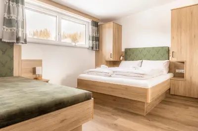 Ein Bett oder Betten in einem Zimmer der Unterkunft Peterlehen Appartements