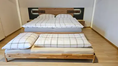 Ein Bett oder Betten in einem Zimmer der Unterkunft Pfleger Ranch am Schönegg Gut