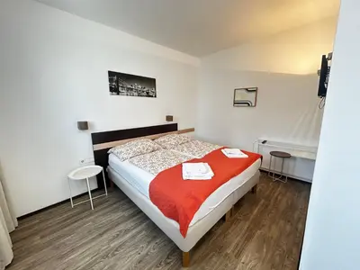 Ein Bett oder Betten in einem Zimmer der Unterkunft Studio65 Vienna