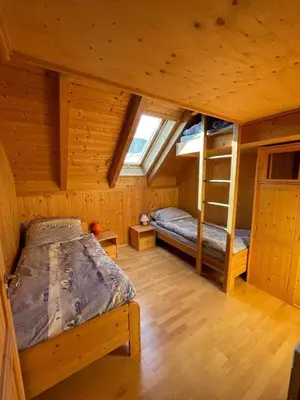 Ein Bett oder Betten in einem Zimmer der Unterkunft Kreischberg Ferien Chalet