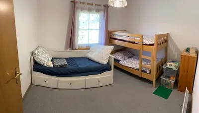 Ein Bett oder Betten in einem Zimmer der Unterkunft Ferienhaus Fuchsbau Hohentauern