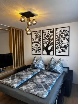 Ein Bett oder Betten in einem Zimmer der Unterkunft Alpenblick - Ferienwohnung Vockner