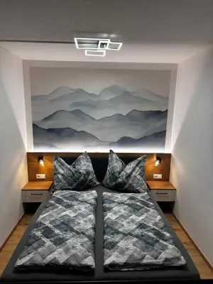 Ein Bett oder Betten in einem Zimmer der Unterkunft Alpenblick - Ferienwohnung Vockner